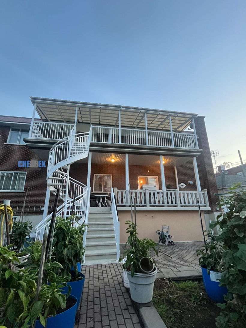 Staircase, balcony, and aluminum awning after installation