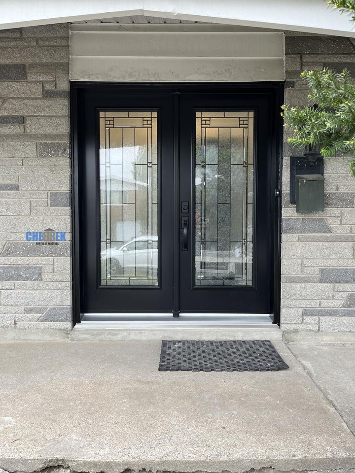 Black double entry door with decorative glass