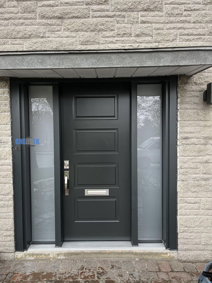 Black steel entry door with two glass sidelights